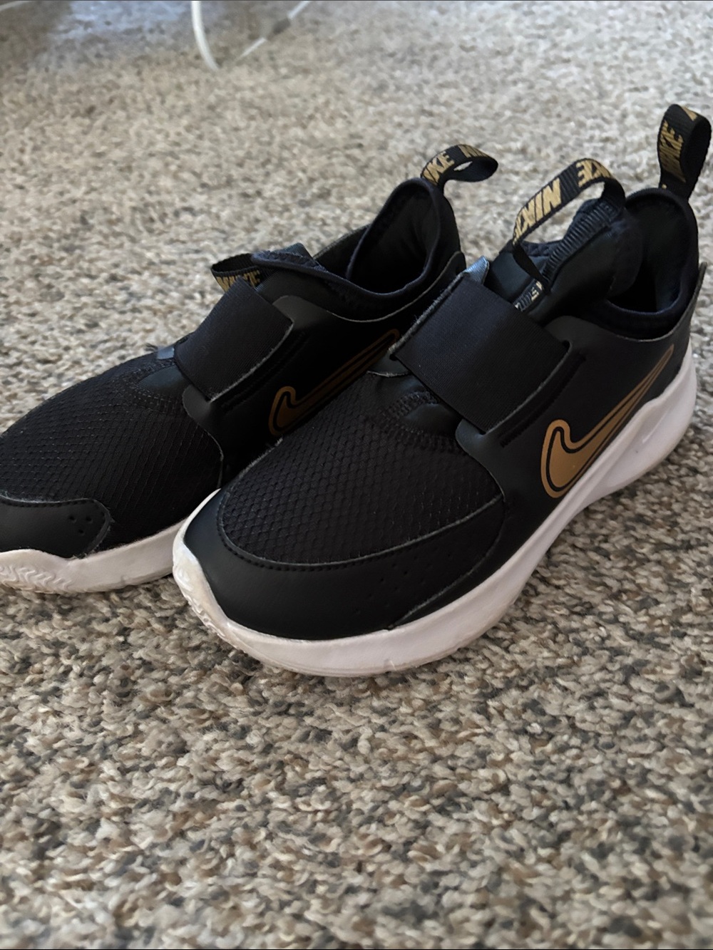 Nike Black and Gold Slip-On Athletic Sneakers